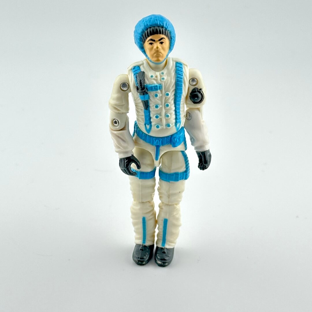 Action figure in a white and blue outfit on a gray background