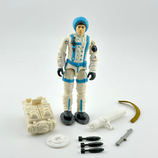GI Joe action figure with accessories against white background. 