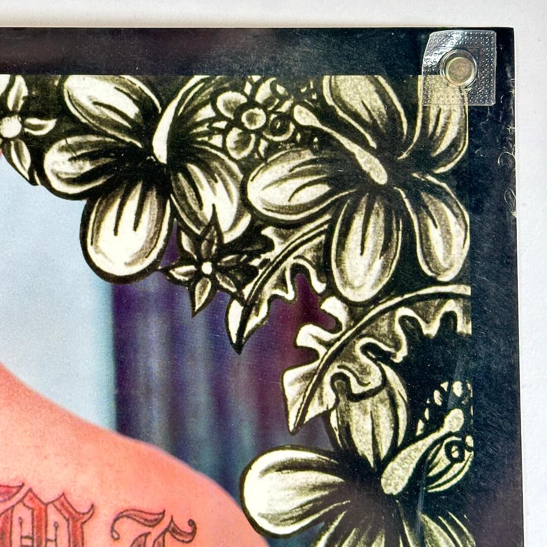 Top right corner with some wear along right edge. 