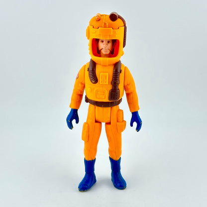 Toy figure in an orange space suit with a helmet on a light gray background