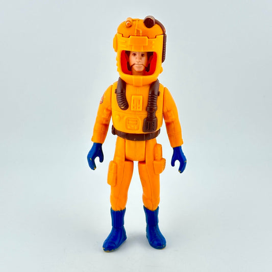 Toy figure in an orange space suit with a helmet on a light gray background