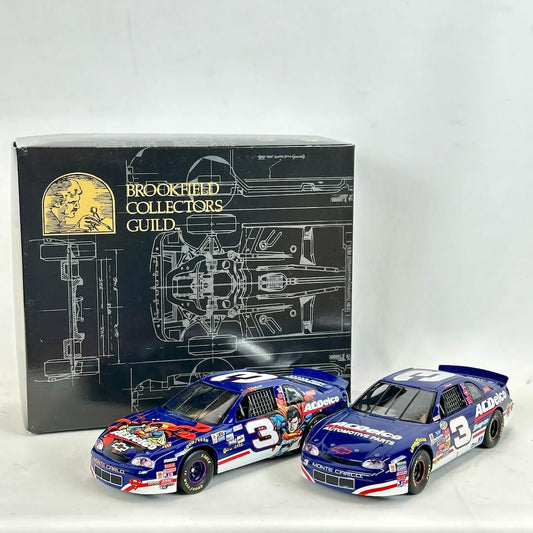 Two model cars with a Brookfield Collectors Guild box in the background