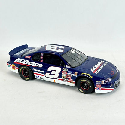 Model race car with multiple sponsor logos on a white background
