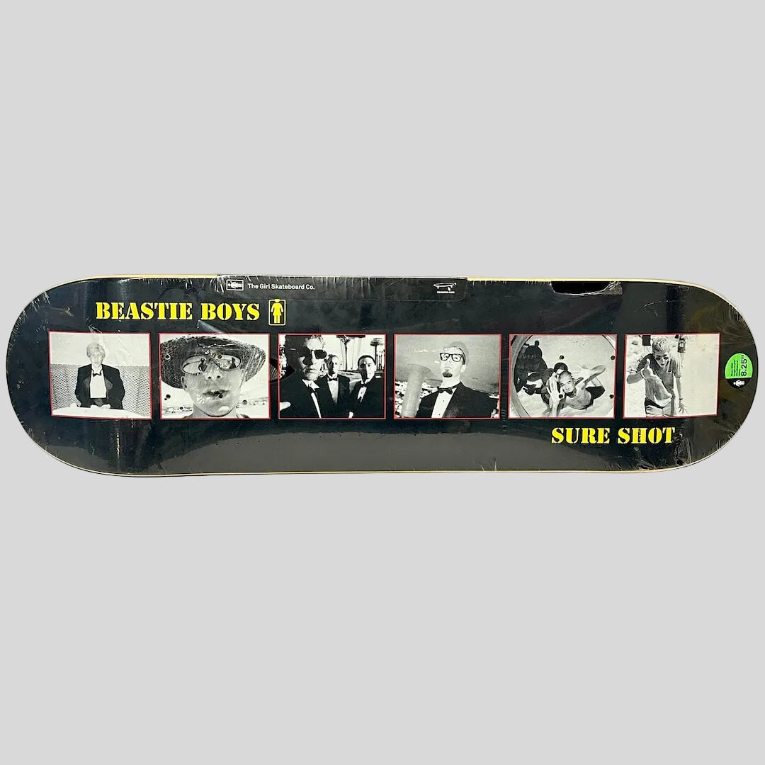 A Beastie Boys 'Sure Shot' skateboard deck in its shrink wrap.