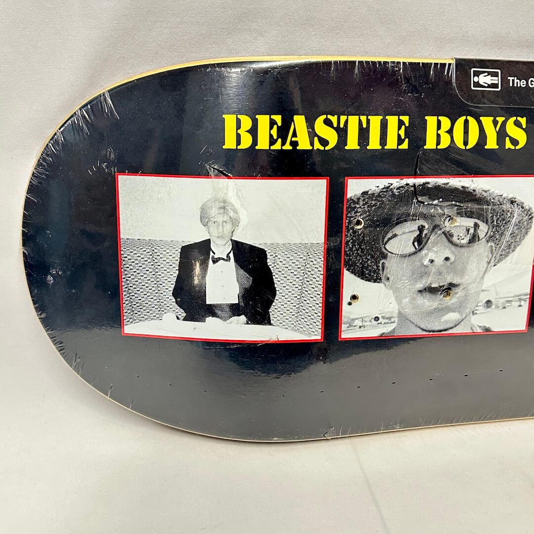 Left side of skateboard to show images up close and condition of plastic wrap. 
