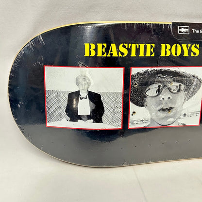 Left side of skateboard to show images up close and condition of plastic wrap. 