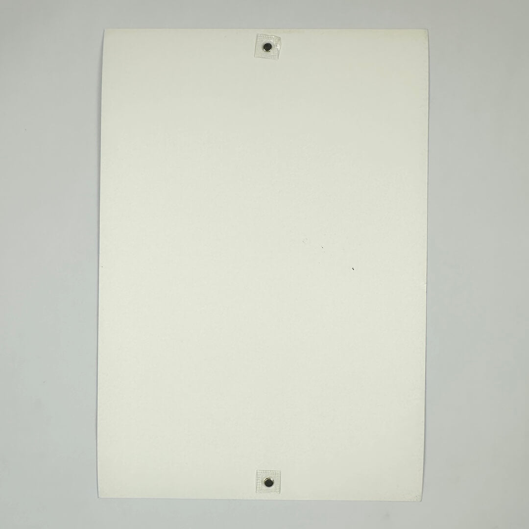 Backside of white poster against white background. 