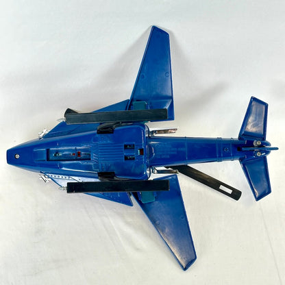 Underside view of toy helicopter showing landing gear and embossed information. 