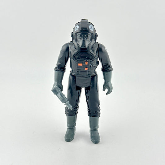 Toy figure in a detailed black suit with helmet on a white background