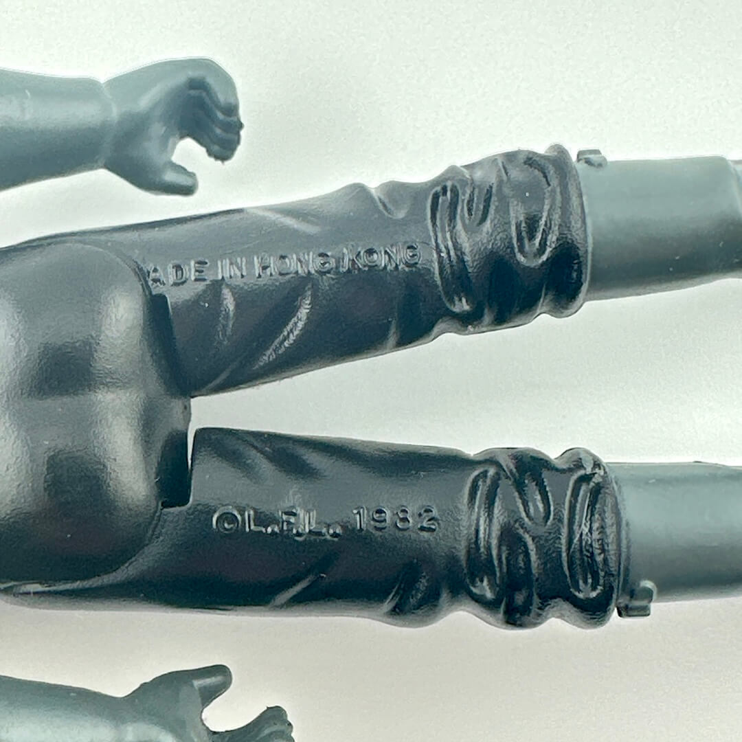 Close-up of back of figure's legs showing COO and copyright information. 