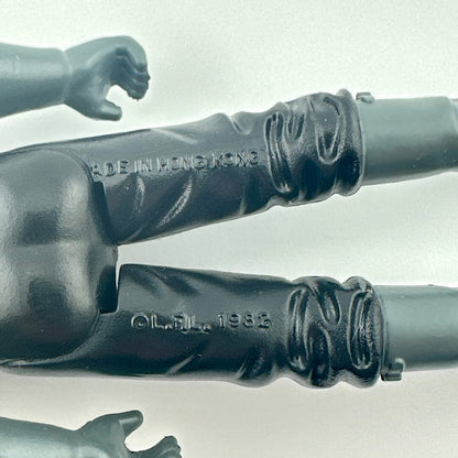 Close-up of back of figure's legs showing COO and copyright information. 