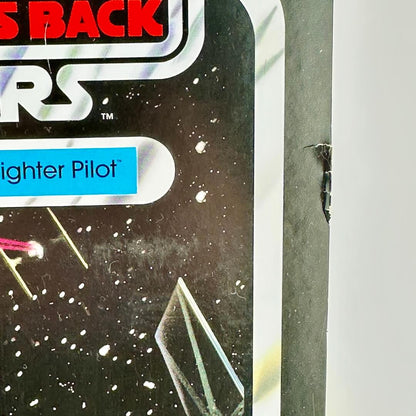 Close-up of rip to side of packaging of Star Wars action figure.