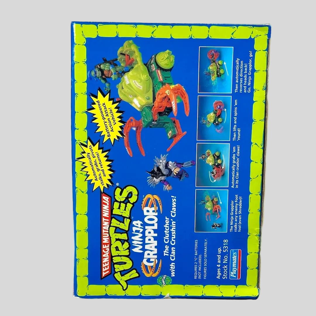 Vintage Teenage Mutant Ninja Turtles toy box with character illustrations on a white background