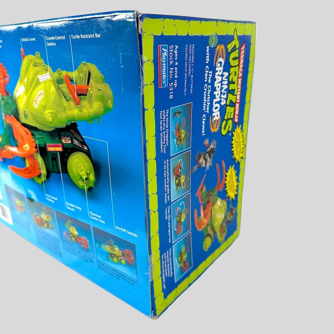 Toy packaging with green turtle figure and blue background