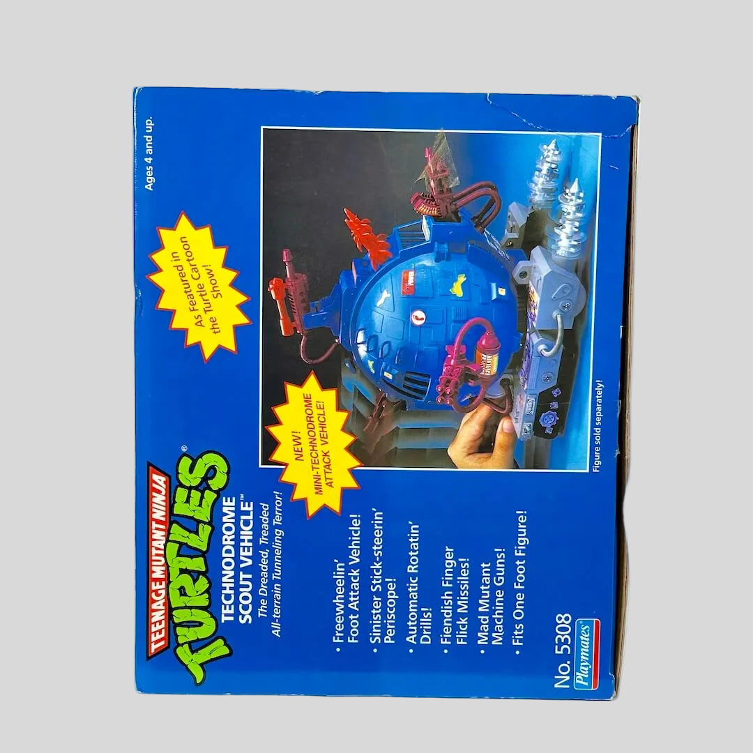 Vintage Teenage Mutant Ninja Turtles toy vehicle packaging on a white background