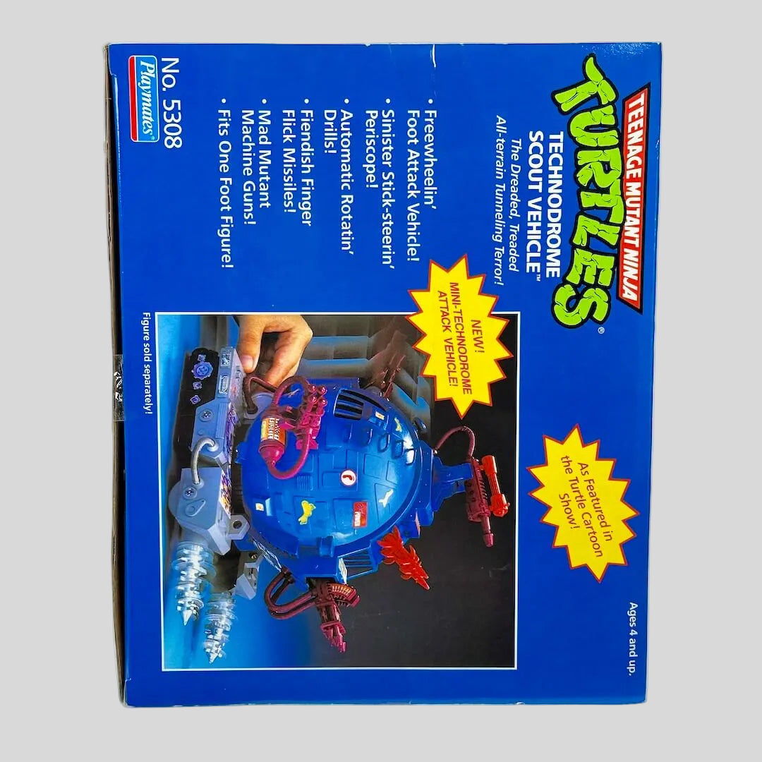 Box of Teenage Mutant Ninja Turtles Technodrome Scout Vehicle on a white background
