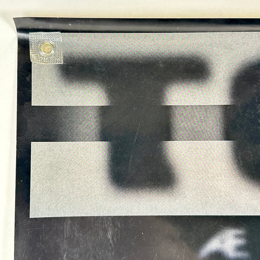 Top left corner with light scratches to face. 