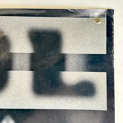 Top right corner with wear to right edge. 