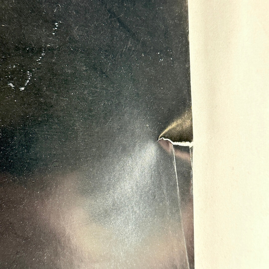 Close up of tear to right edge. 