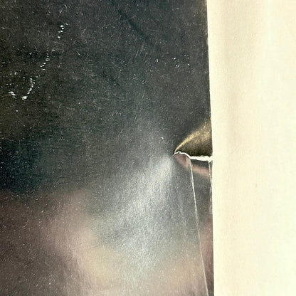 Close up of tear to right edge. 