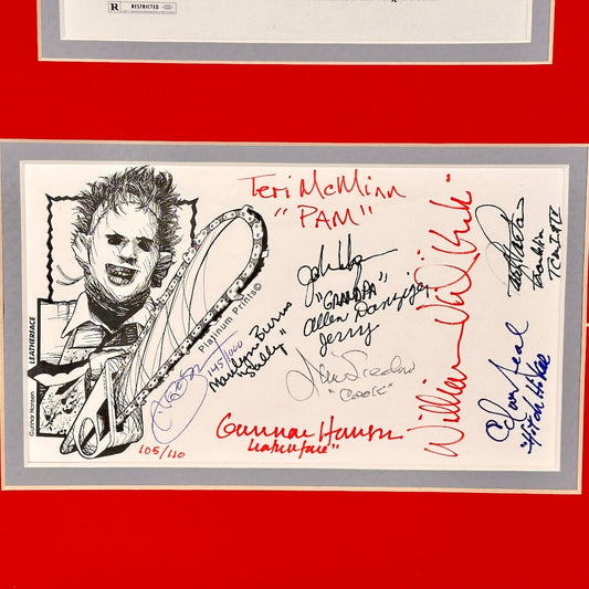 Autographed card with a drawing of a character and multiple signatures on a red background