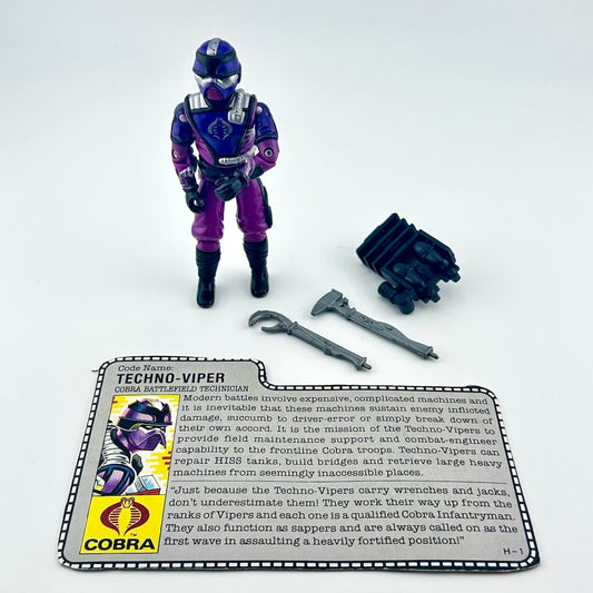 G.I. Joe action figure with accessories and character card against white background.
