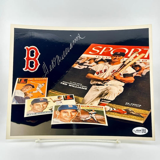 Photo of collection of Ted Williams sports memorabilia including cards and a Sports Illustrated cover against white background. 