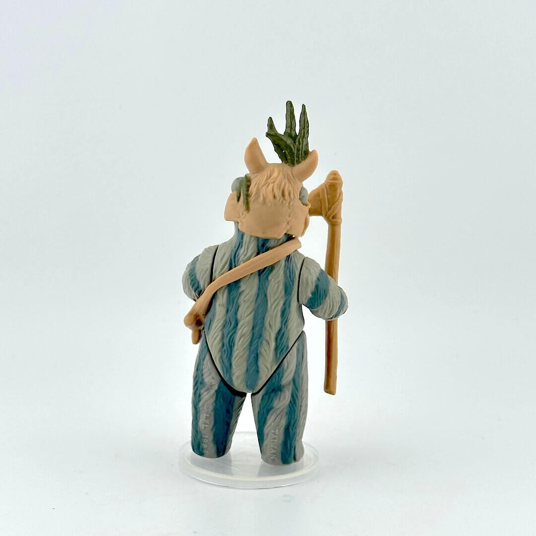 Ewok action figure with striped fur with accessories against white background.