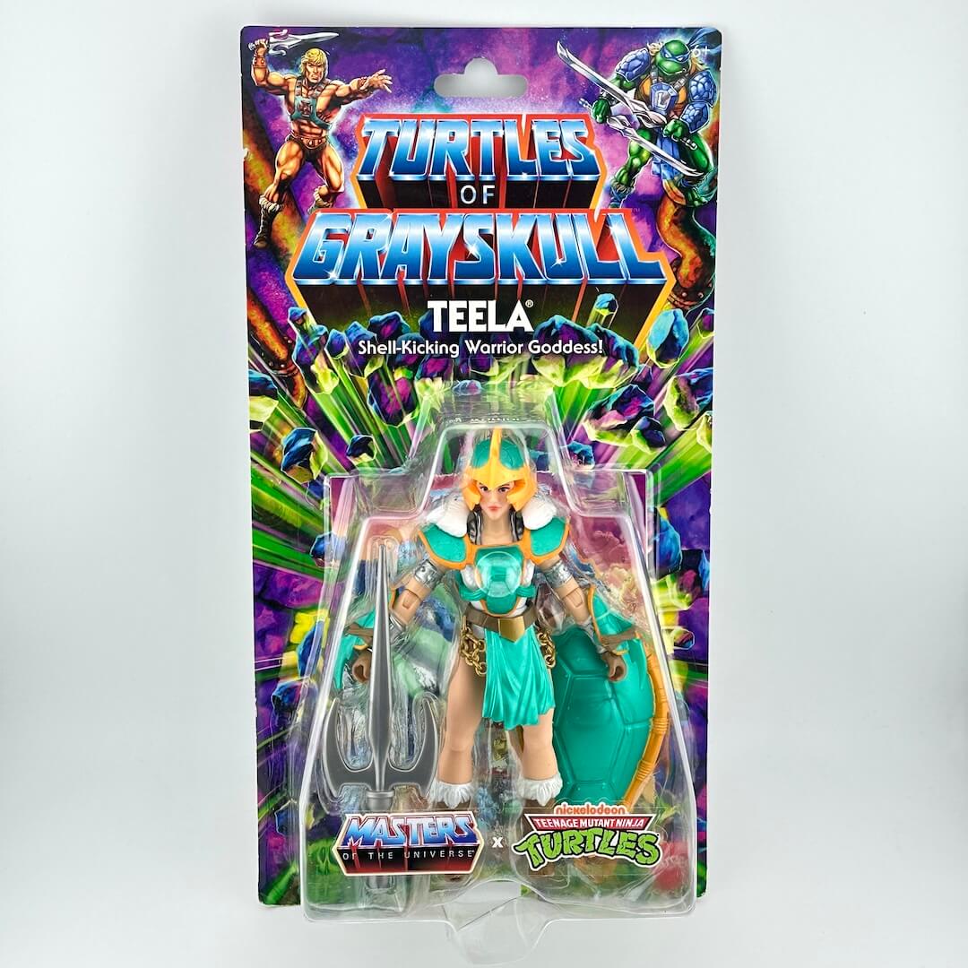 Masters of the Universe x TMNT action figure of Teela from Grayskull, in its original blister card packaging.