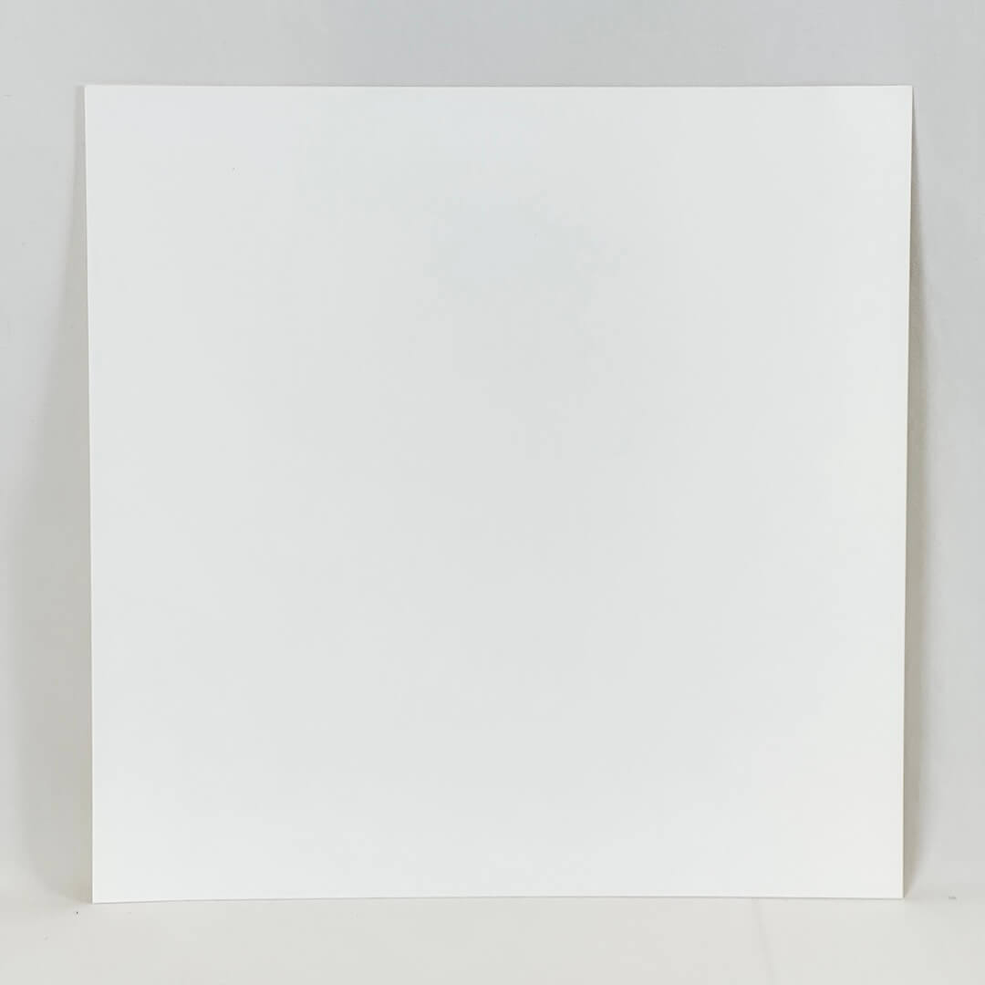 Reverse side of print. A plain white square of paper against a plain white background. 