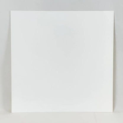 Reverse side of print. A plain white square of paper against a plain white background. 