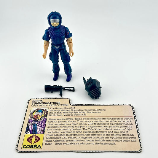 G.I. Joe action figure with accessories and character card against white background.