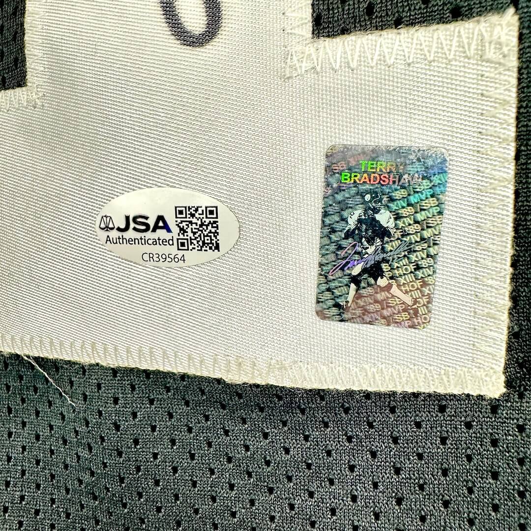 Close-up of JSA authentication sticker and Terry Bradshaw holographic sticker. 