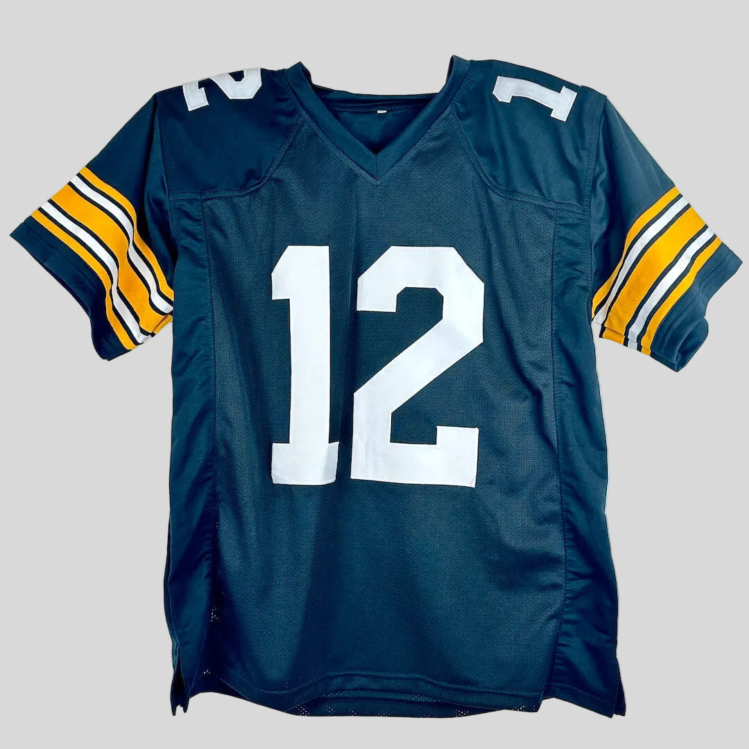 A black football jersey featuring the number 12 in white on the front and yellow, white, and black stripes on the sleeves.
