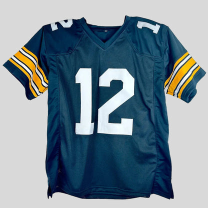A black football jersey featuring the number 12 in white on the front and yellow, white, and black stripes on the sleeves.