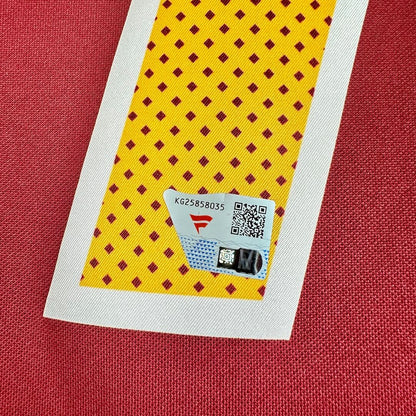 Close-up of Fanatics authentication sticker on number '17' on red and yellow football jersey. 