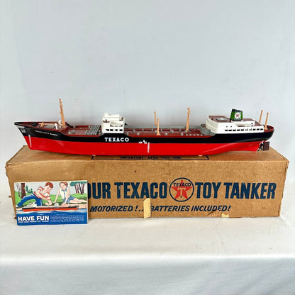 Model toy tanker ship on a cardboard box with Texaco branding