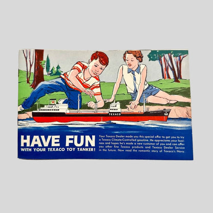 Vintage Texaco toy tanker advertisement with children playing with a model ship on a white background