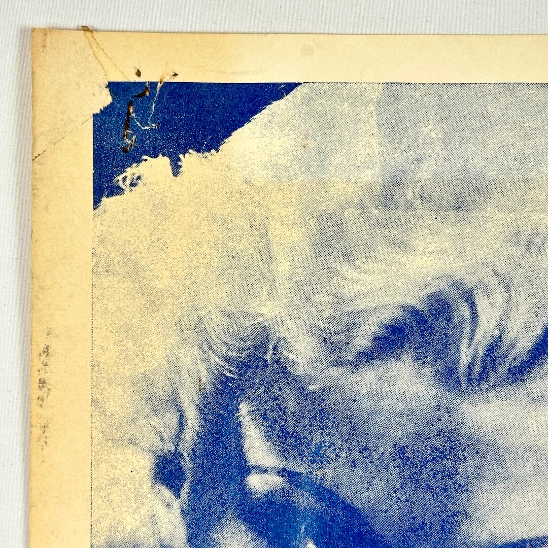 Top left corner with pin holes and tape marks. 