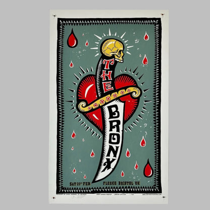 Sage green background with dagger and heart. The BRONX is spelled on the knife blade. Drops of blood around it.  