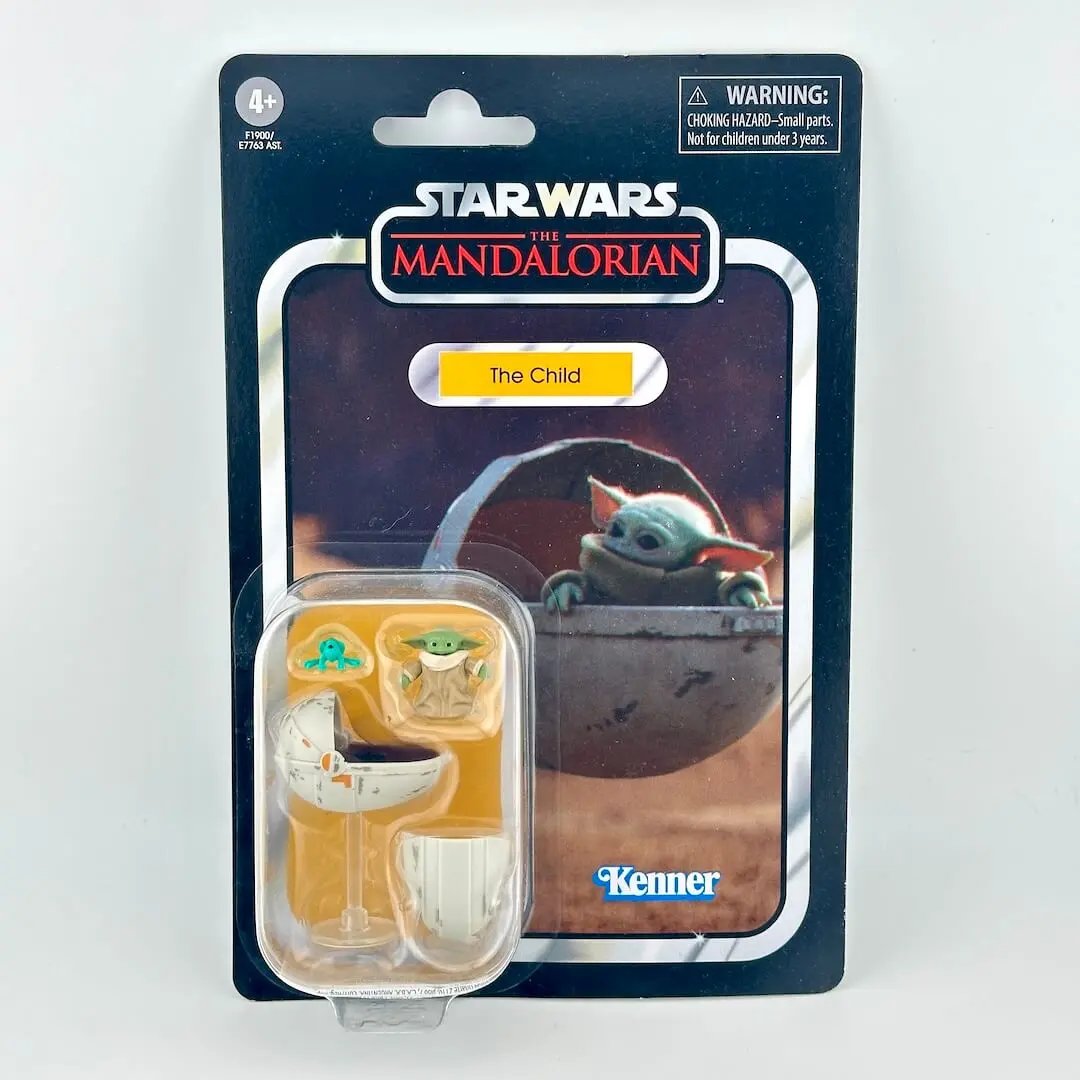 Star Wars: The Mandalorian 'The Child' action figure in its original retro-style carded packaging.