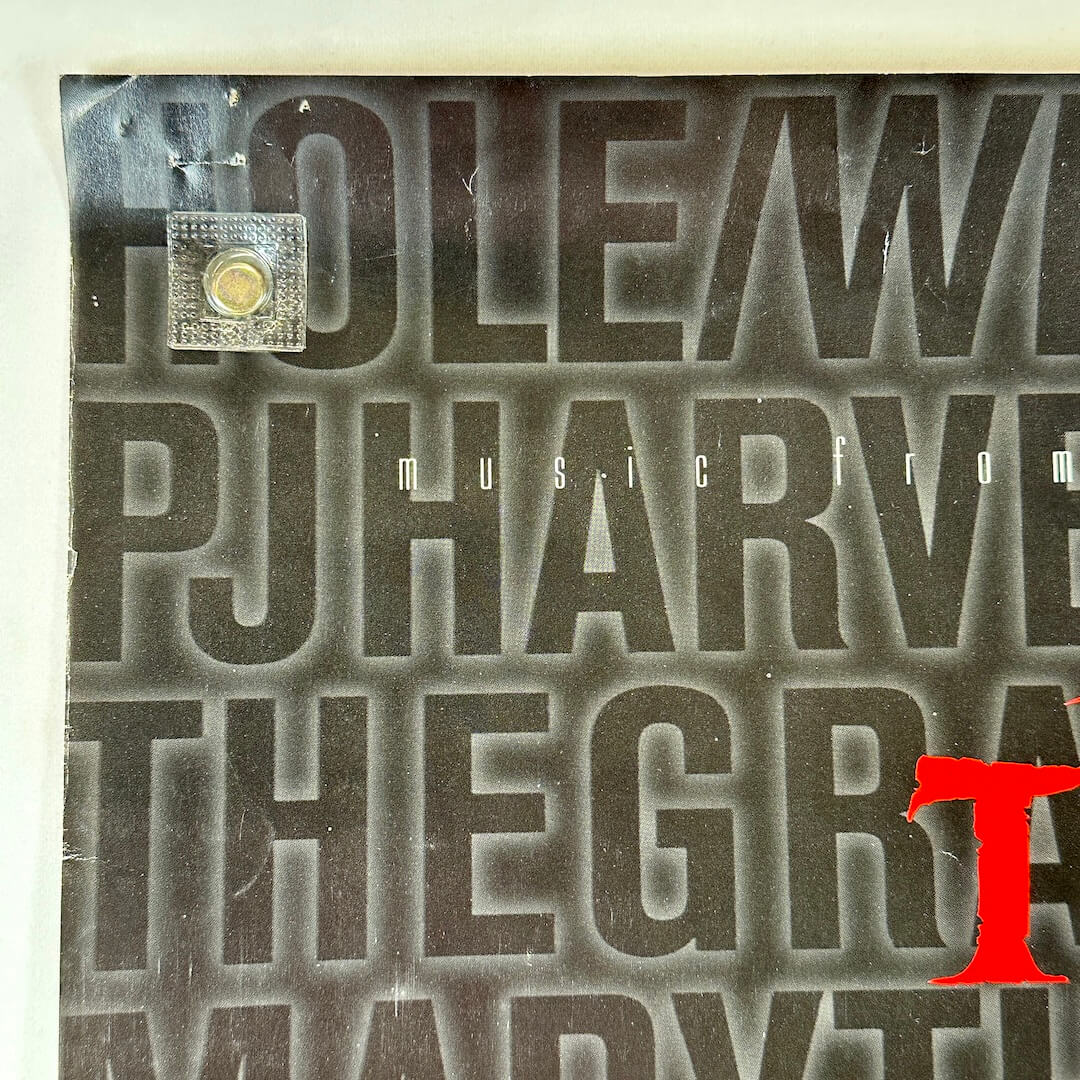 Top left corner with pin holes and some creasing 