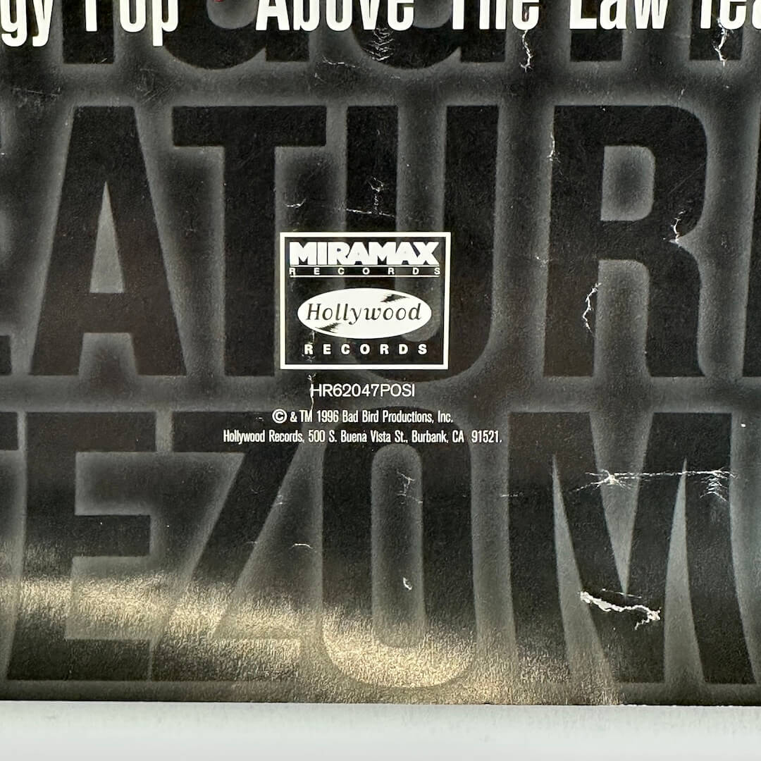 Bottom center of poster showing copyright info and more damage to poster.