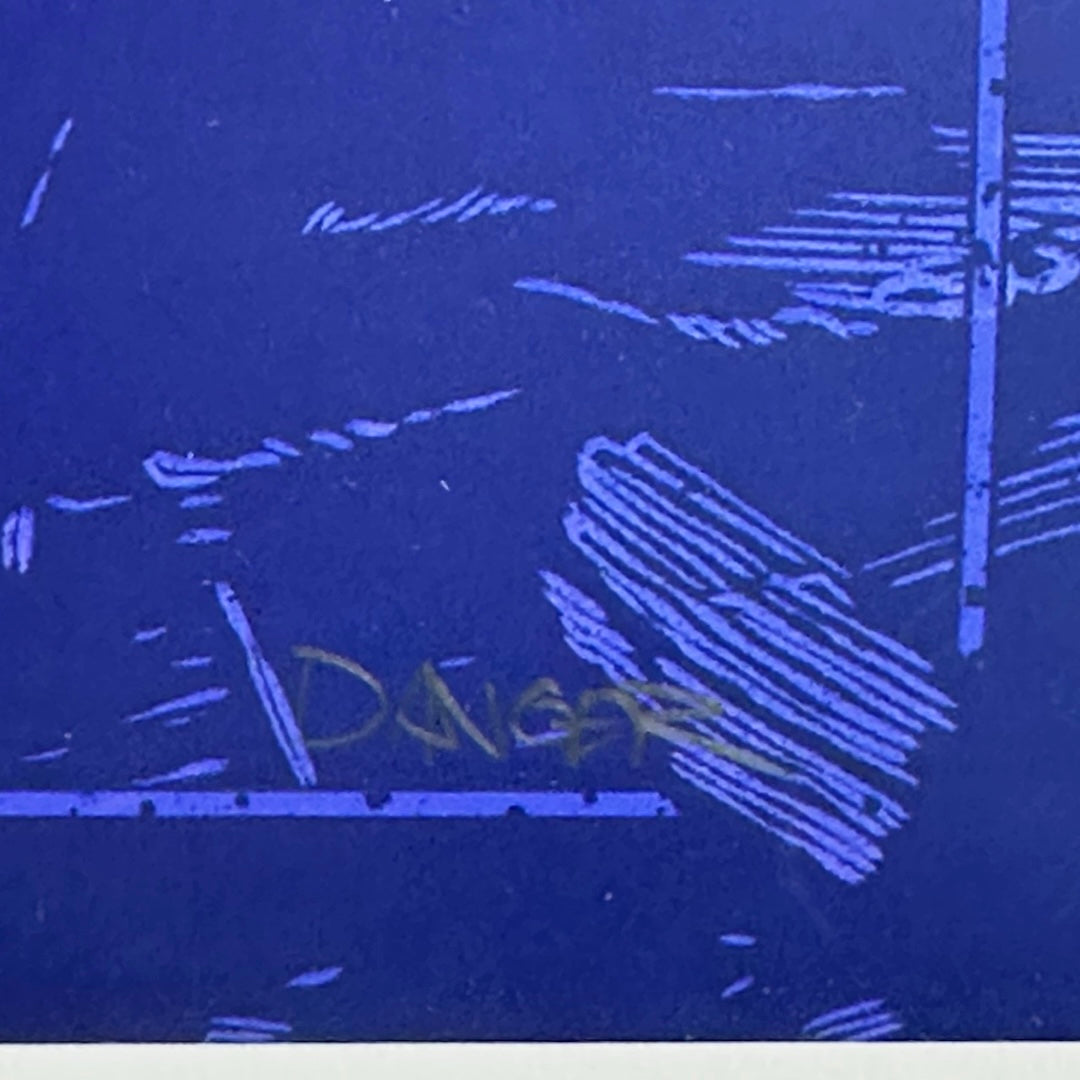 Close up of artist signature in pencil on blue line border. Clean edge below.