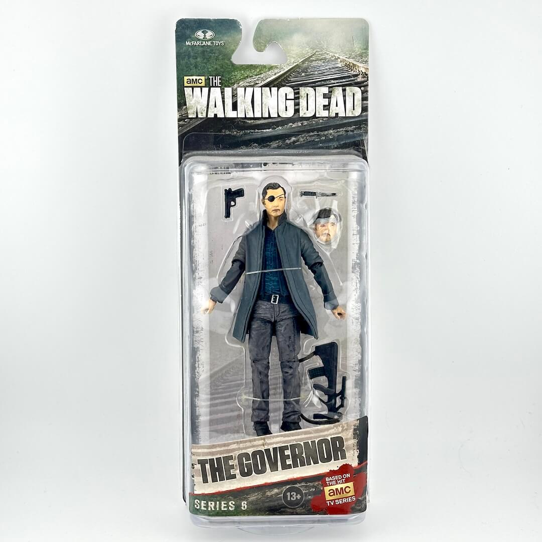 The Walking Dead Series 6 action figure of The Governor in his signature gray suit, packaged in its original blister card.