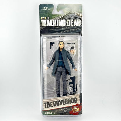 The Walking Dead Series 6 action figure of The Governor in his signature gray suit, packaged in its original blister card.