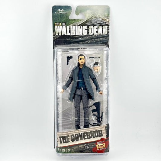 The Walking Dead Series 6 action figure of The Governor in his signature gray suit, packaged in its original blister card.