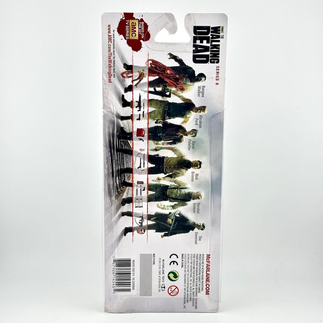 A packaged action figure from The Walking Dead, shown on its original retail blister card.