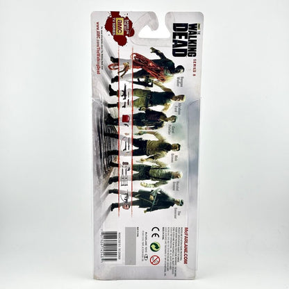 A packaged action figure from The Walking Dead, shown on its original retail blister card.