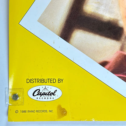 Bottom left corner with smudge, and some edge and corner wear. 